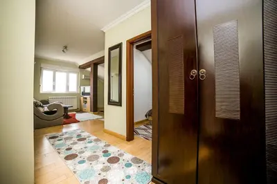 a hallway with a door and a rug at Residence Amelie in Belgrade