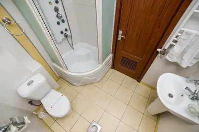 a bathroom with a shower and a toilet and a sink at Residence Amelie in Belgrade