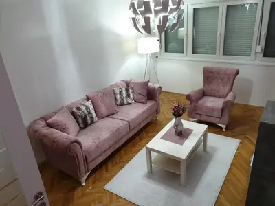 a living room with a couch and two chairs at Apartment Centar Exclusive Smederevo in Smederevo