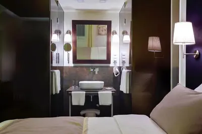 a bathroom with a sink and a mirror at 4Rooms 4U in Belgrade