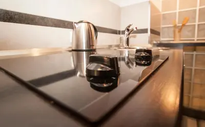 a kitchen counter with a sink and a faucet at Piano Cube in Belgrade