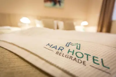 a close up of a bed in a hotel room at Hotel Mar Garni in Belgrade