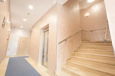 a staircase in a building with wooden steps at Hotel Mar Garni in Belgrade