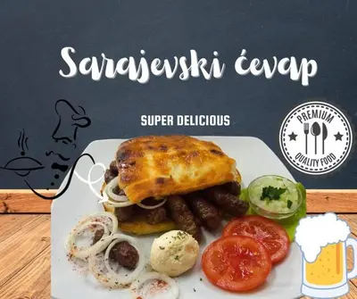 a plate of food with a sandwich and vegetables at Hotel Vila Sunce in Stara Pazova