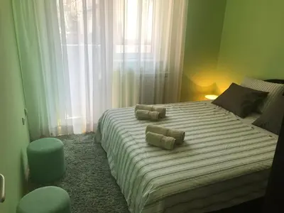 a bedroom with a large bed with two pillows on it at Apartman AS in Belgrade