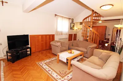 a living room with two couches and a tv at NOBLES APARTMENT 4**** in Belgrade