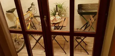 a view of a room with a bike and a table at NOBLES APARTMENT 4**** in Belgrade