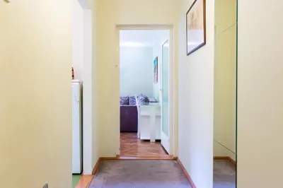 a hallway with a door leading into a room at Captain's Crib in Belgrade