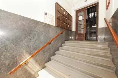 a staircase leading to a building with a door at Apartment Treci in Belgrade