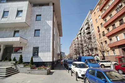 a busy city street with cars parked on the sidewalk at Bianca in Belgrade