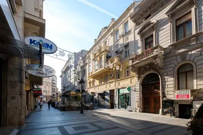 a street in a city with many buildings at Jolie in Belgrade