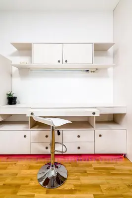 a white desk in a room with white cabinets at Loko Savada in Belgrade
