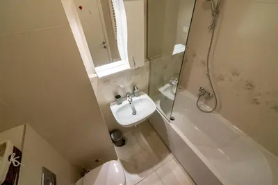 a bathroom with a sink and a shower and a toilet at Loko Savada in Belgrade