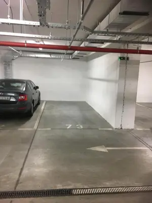 a parking garage with a car parked in it at Loko Savada in Belgrade