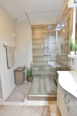 a bathroom with a shower with plants in it at Apartman SUN in Inđija