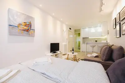 a living room with a bed and a couch at Apartment Hana Lux-Cozy Studio Near Danube, Quite & Bright in Belgrade