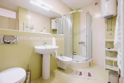 a bathroom with a sink and a shower and a toilet at Apartment Hana Lux-Cozy Studio Near Danube, Quite & Bright in Belgrade