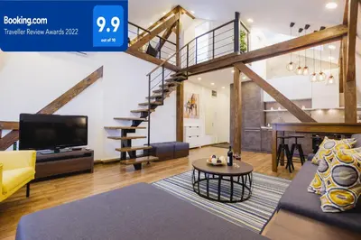 a living room with a couch and a tv at Apartment Lea Lux-5 min to Danube, Quite & Cozy, Easy parking nearby in Belgrade