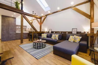 a living room with a couch and a table at Apartment Lea Lux-5 min to Danube, Quite & Cozy, Easy parking nearby in Belgrade