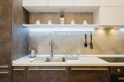 a kitchen with a sink and a counter at Apartment Lea Lux-5 min to Danube, Quite & Cozy, Easy parking nearby in Belgrade