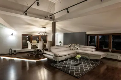 a living room with a couch and a table at ONE Apartment in Belgrade