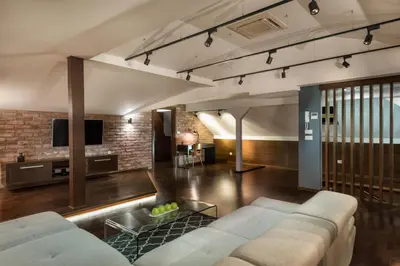 a living room with a couch and a tv at ONE Apartment in Belgrade