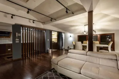 a living room with a couch and a table at ONE Apartment in Belgrade