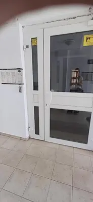 an open door in a room with a room with a table at Sobe Neva in Belgrade