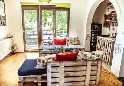 a living room with a couch and a table at Branch in Arandjelovac