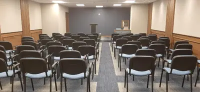 a lecture room with chairs and a podium in it at Hotel Centar No.1 in Belgrade