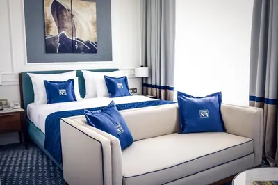 a hotel room with a bed and a couch at Hotel Centar No.1 in Belgrade