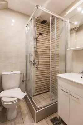 a bathroom with a shower and a toilet and a sink at GRACE in Tošin Bunar