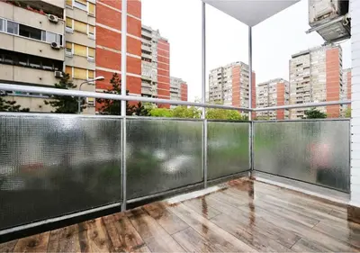 an empty balcony with a view of a city at Apartment Delta Sava New Belgrade in Belgrade