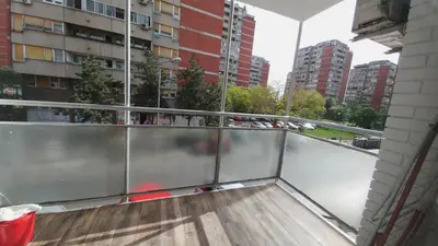 an empty balcony with a view of a city at Apartment Delta Sava New Belgrade in Belgrade