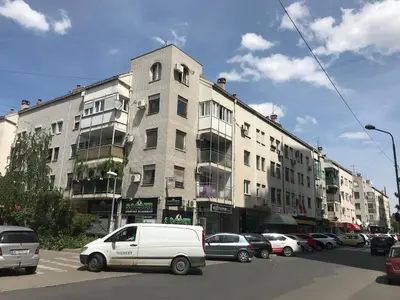 a white van parked in front of a building at Apartment Delta Sava New Belgrade in Belgrade