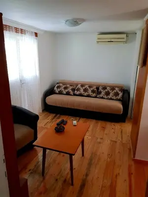 a living room with a couch and a coffee table at HELONA in Arandjelovac