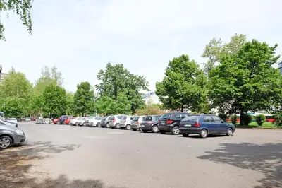 a row of cars parked in a parking lot at Belgrade Sweet Home Apartment in Belgrade