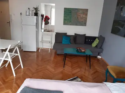 a living room with a couch and a table at Atelier 22 in Belgrade