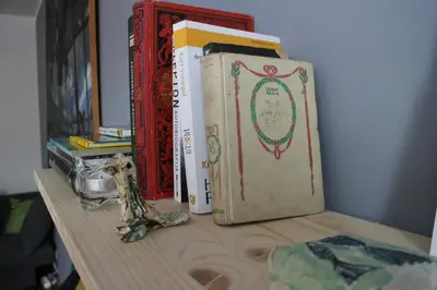 a group of books sitting on top of a table at Atelier 22 in Belgrade