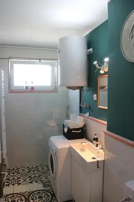 a bathroom with a toilet and a sink at Atelier 22 in Belgrade