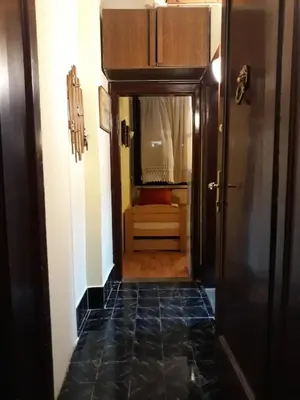 a hallway with a door leading to a room at Garden studio in Belgrade