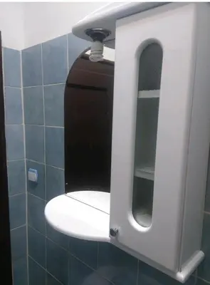 a mirror in a bathroom with a sink at Garden studio in Belgrade