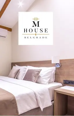 a bedroom with two beds and a n house residence at M House Belgrade Residence in Belgrade