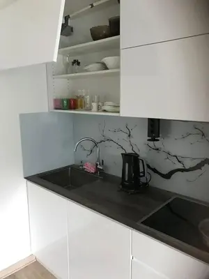 a kitchen with a sink and a counter top at Apartman Oslo in Belgrade