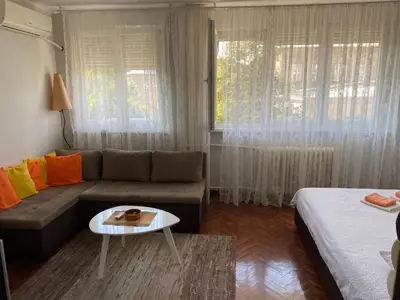a living room with a couch and a table at Apartment Dada Center of Belgrade in Belgrade