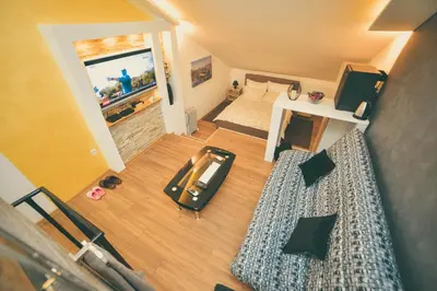 an overhead view of a living room with a car on the floor at Apartman Las Vegas in Belgrade