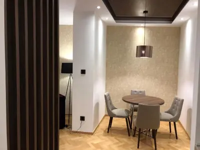 a dining room with a table and chairs at Aria Royal apartment in Belgrade