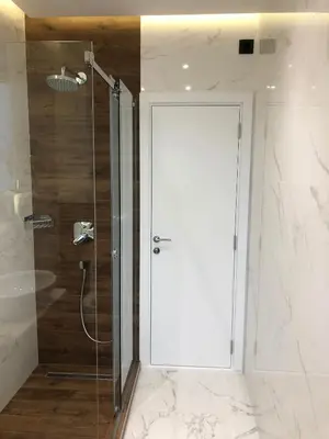 a shower with a glass door in a bathroom at Aria Royal apartment in Belgrade