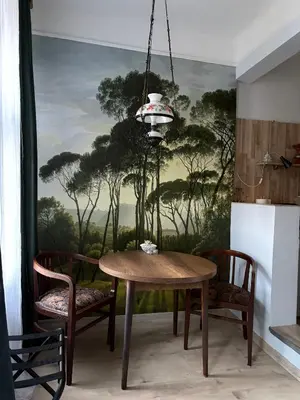 a dining room with a table and two chairs at Oaza 26 in Belgrade