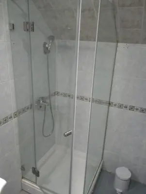a shower with a glass door in a bathroom at Dolce Casa in Belgrade